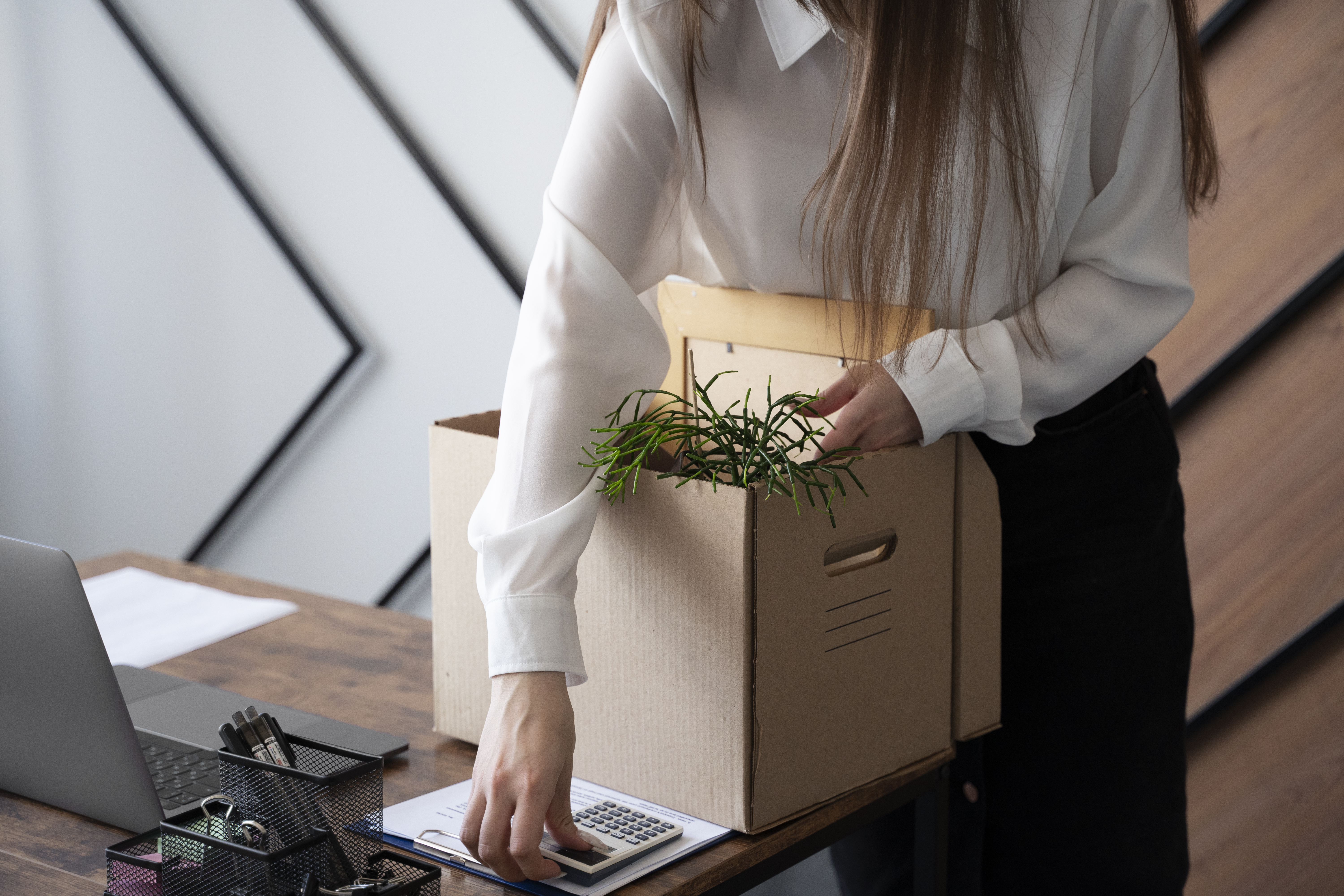 high-angle-woman-with-cardboard-box.jpg