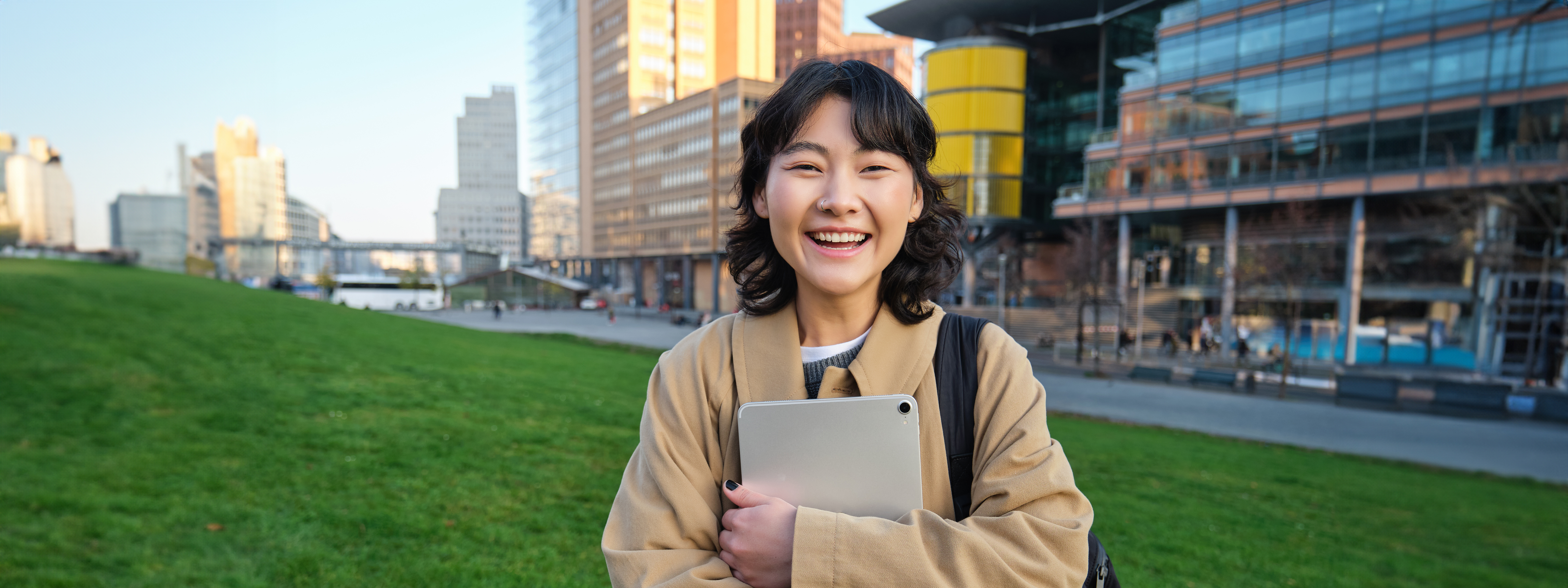 image-korean-girl-with-happy-face-walks-around-town-with-student-tablet-stands-street.jpg