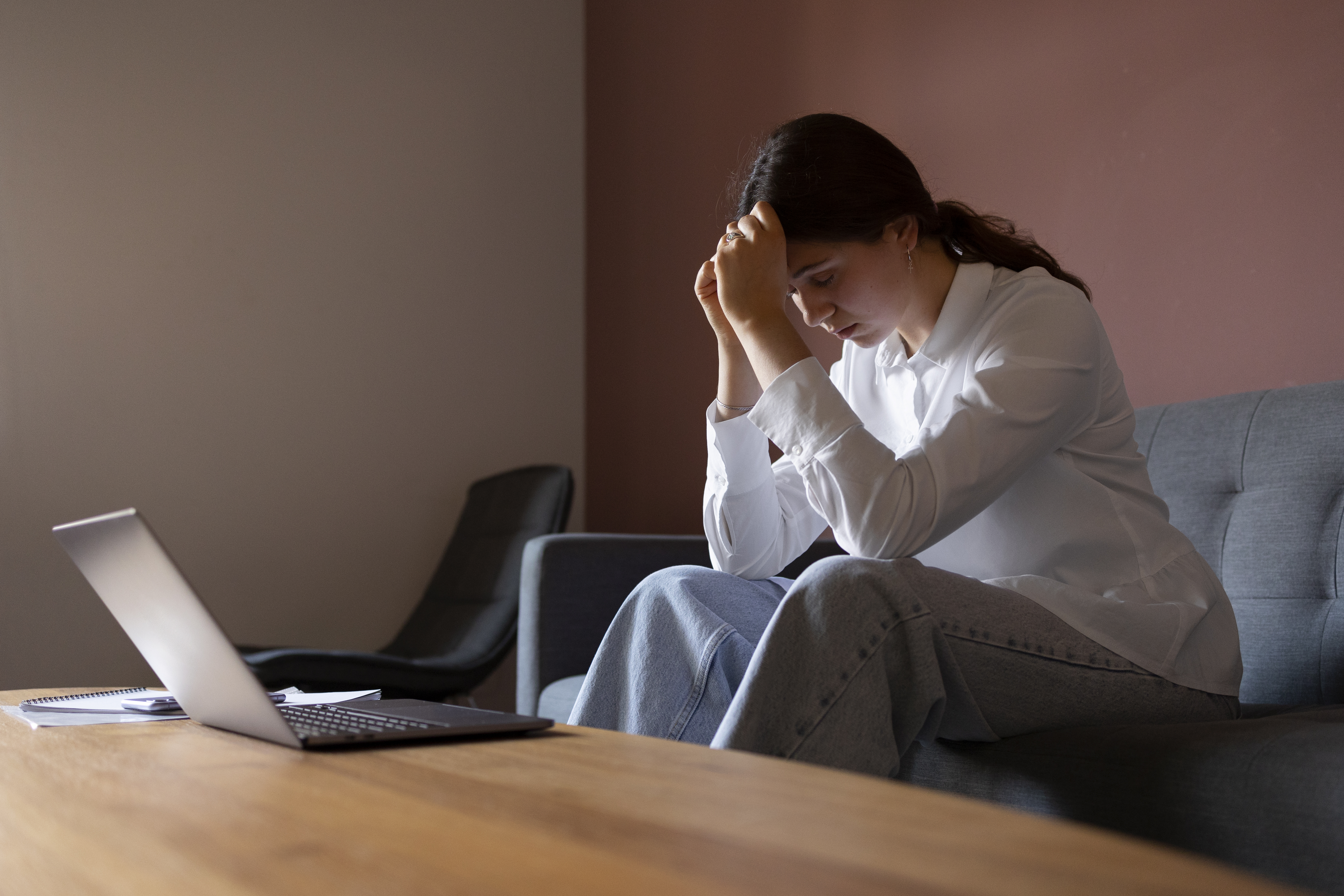 woman-sitting-couch-side-view.jpg